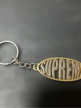 Supreme Two-Tone Oval Logo Keychain — Silver & Gold